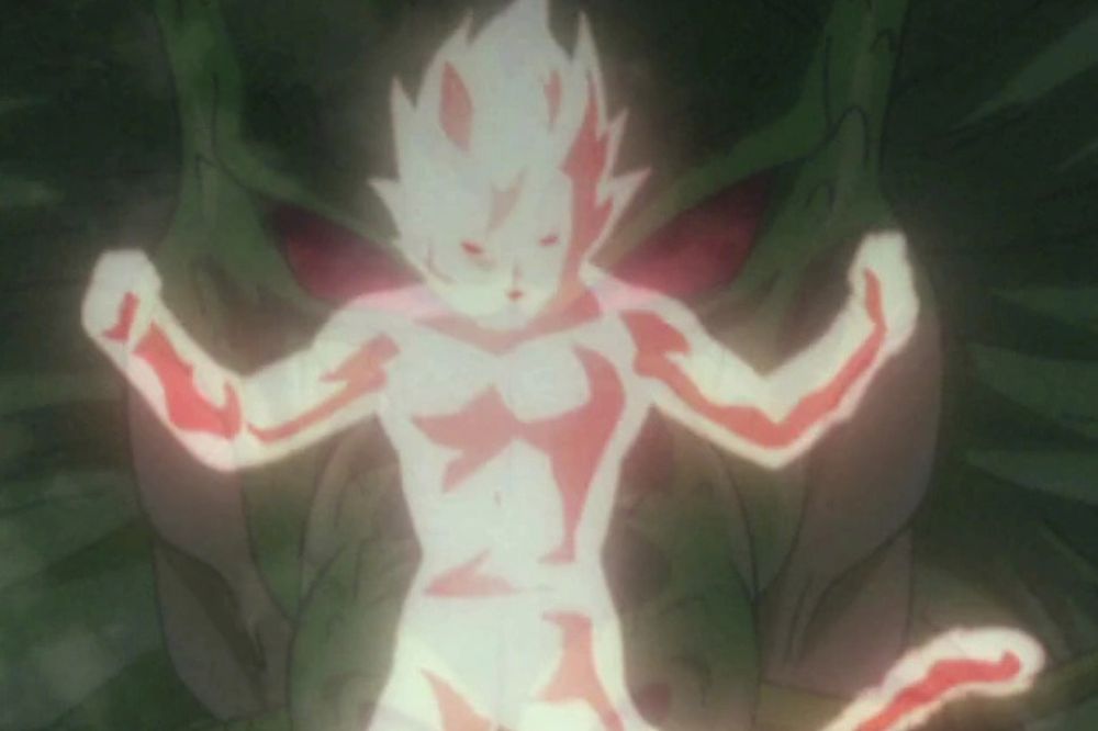 Silhouette lumineuse d’un Saiyan entouré d’une aura blanche et rouge, flottant dans un décor sombre.